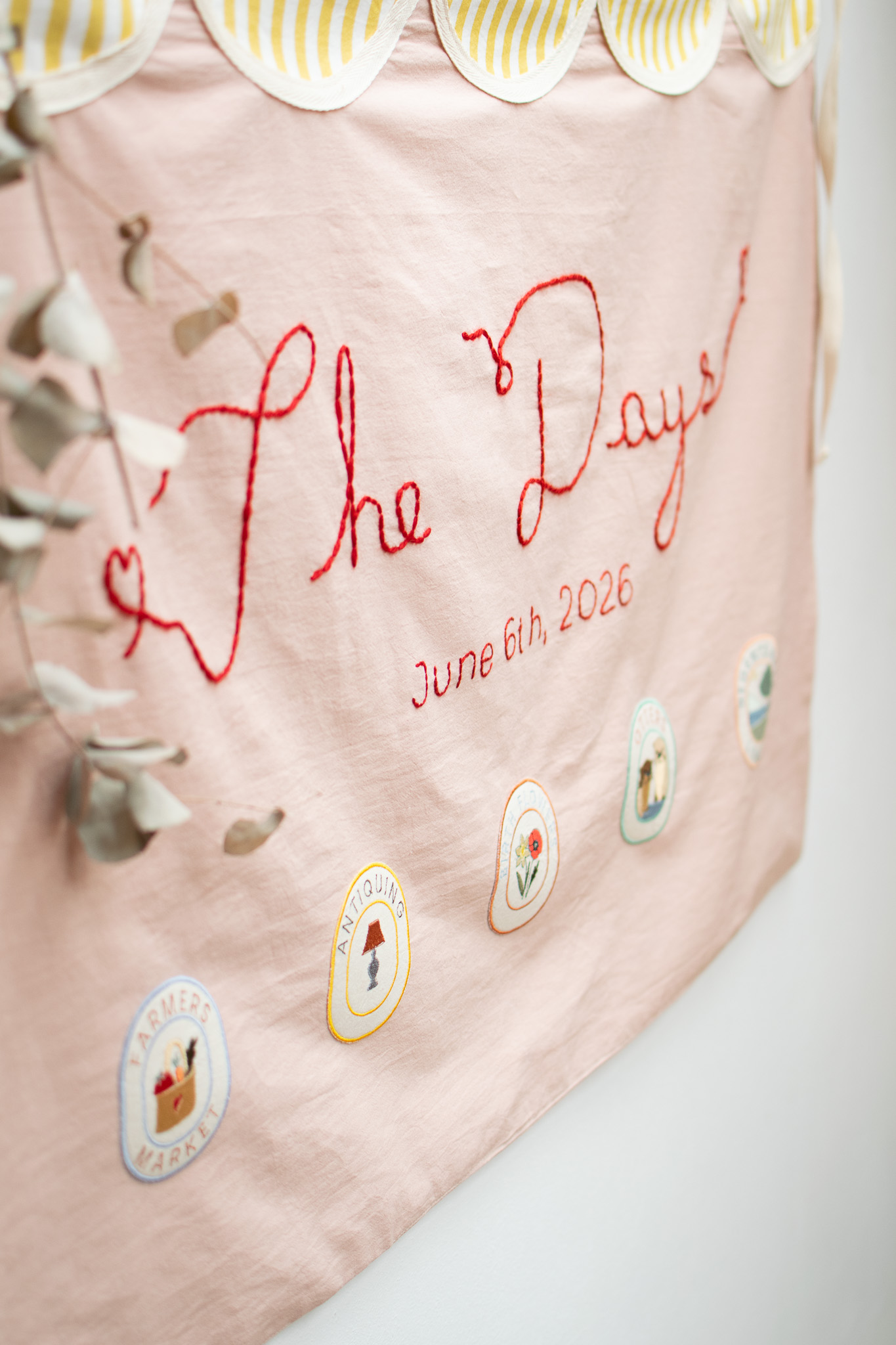 Artisanal embroidered wedding table runner with botanical motifs